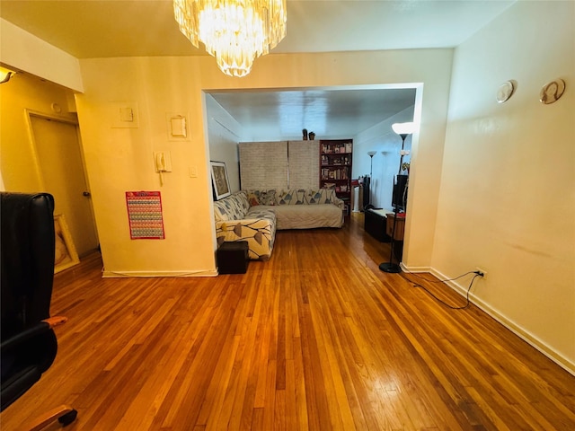 63-84 Saunders St Unit 2G, Rego Park, NY 11374 - living room featuring wood finished floors and a chandelier
