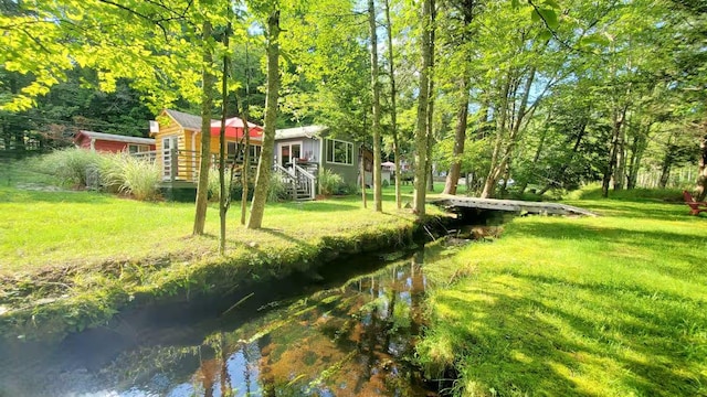 39 E James Ave, Smallwood, NY 12778 - view of grassy yard with an outdoor structure and a view of trees