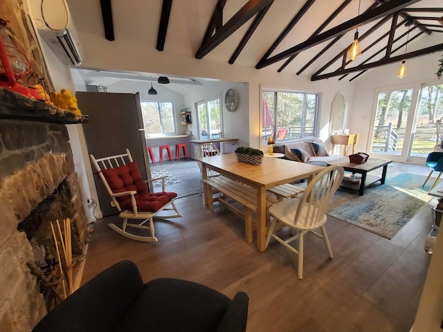 39 E James Ave, Smallwood, NY 12778 - dining room featuring a stone fireplace, wood finished floors, and a wall mounted AC