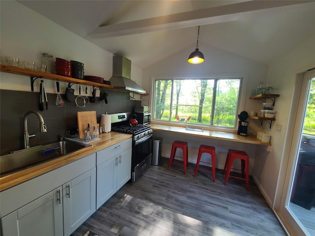 39 E James Ave, Smallwood, NY 12778 - kitchen featuring open shelves, stainless steel range with gas cooktop, wall chimney range hood, and tasteful backsplash