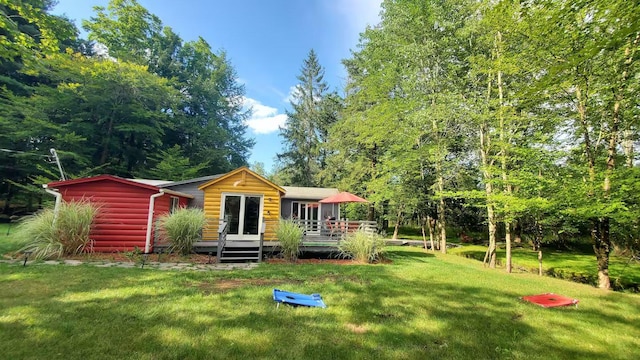 39 E James Ave, Smallwood, NY 12778 - rear view of house featuring a deck, a yard, and faux log siding