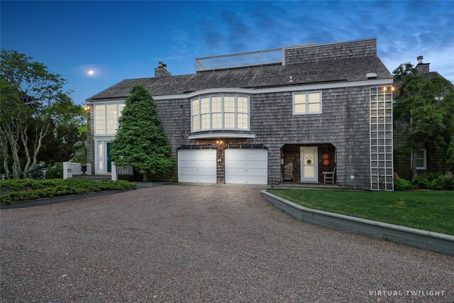 56 Tuthill Point Rd, East Moriches, NY 11940 - view of front of house featuring driveway, an attached garage, a front lawn, and a chimney