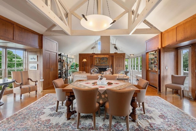 56 Tuthill Point Rd, East Moriches, NY 11940 - dining space with light wood finished floors and a lit fireplace