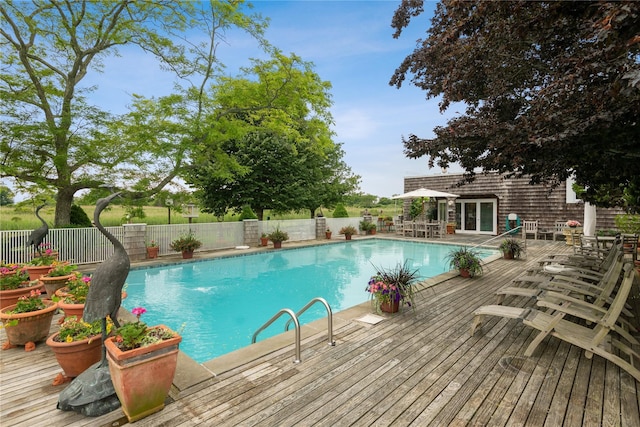 56 Tuthill Point Rd, East Moriches, NY 11940 - view of pool featuring a fenced backyard, a wooden deck, and outdoor dining area