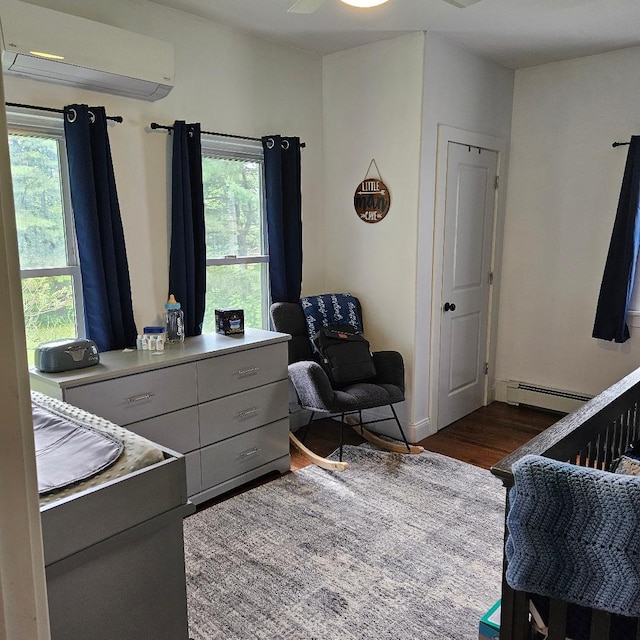 15 Wilmar Ter, Poughkeepsie, NY 12601 - bedroom featuring a wall unit AC, baseboard heating, and dark wood finished floors