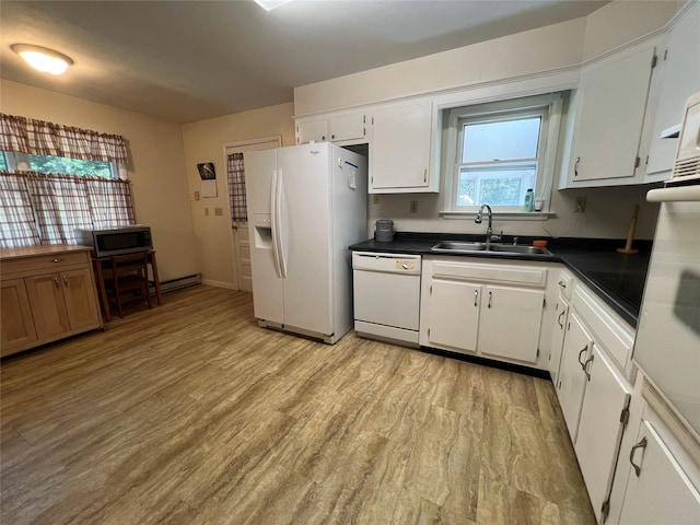 39 Hilltop Ln, Narrowsburg, NY 12764 - kitchen with white appliances, dark countertops, light wood-style floors, white cabinets, and baseboard heating