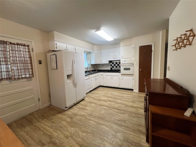 39 Hilltop Ln, Narrowsburg, NY 12764 - kitchen featuring white appliances, dark countertops, white cabinets, and light wood-type flooring