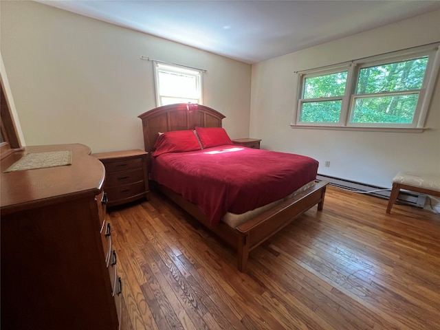 39 Hilltop Ln, Narrowsburg, NY 12764 - bedroom featuring hardwood / wood-style floors, multiple windows, and a baseboard heating unit