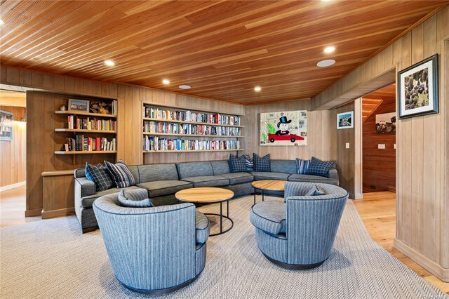 174 Dune Rd, Quogue, NY 11959 - living area with wooden walls, wooden ceiling, built in features, light wood-style flooring, and recessed lighting