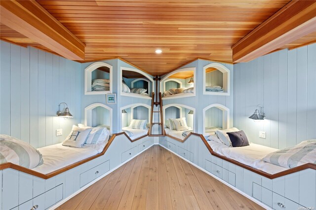 174 Dune Rd, Quogue, NY 11959 - bedroom featuring wood ceiling, hardwood / wood-style flooring, and wood walls