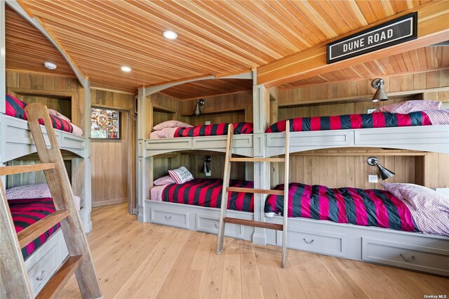 174 Dune Rd, Quogue, NY 11959 - bedroom with wood ceiling, wooden walls, recessed lighting, and wood finished floors