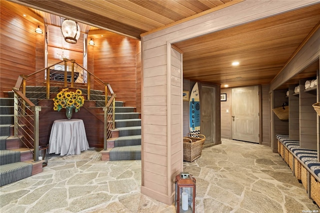 174 Dune Rd, Quogue, NY 11959 - interior space with stone floors, wooden ceiling, stairs, recessed lighting, and wood walls
