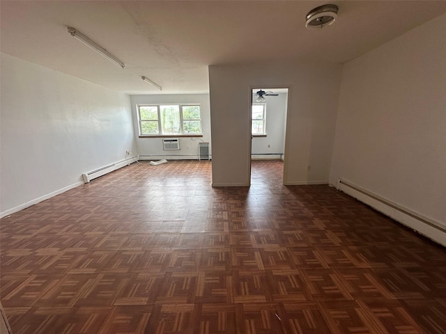 9444 45th Ave, Elmhurst, NY 11373 - spare room featuring a baseboard heating unit, a wall unit AC, and a ceiling fan