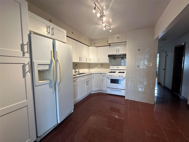 9444 45th Ave, Elmhurst, NY 11373 - kitchen featuring white appliances, white cabinetry, under cabinet range hood, light countertops, and dark tile patterned floors