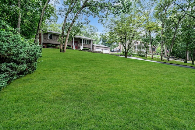 38 Mcarthur Ln, Smithtown, NY 11787 - view of grassy yard with a porch