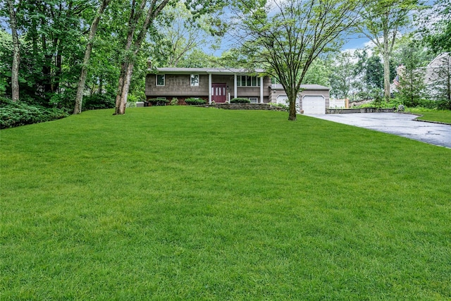 38 Mcarthur Ln, Smithtown, NY 11787 - raised ranch with a front yard, a garage, covered porch, and driveway