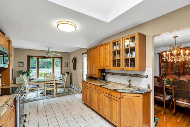 38 Mcarthur Ln, Smithtown, NY 11787 - kitchen with stainless steel electric range, ceiling fan, backsplash, light stone countertops, and glass insert cabinets