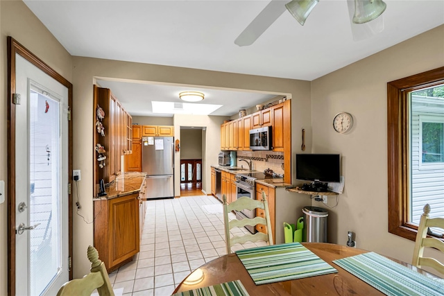 38 Mcarthur Ln, Smithtown, NY 11787 - dining room featuring light tile patterned floors and a ceiling fan