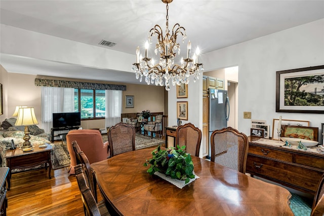 38 Mcarthur Ln, Smithtown, NY 11787 - dining space featuring a chandelier and wood finished floors
