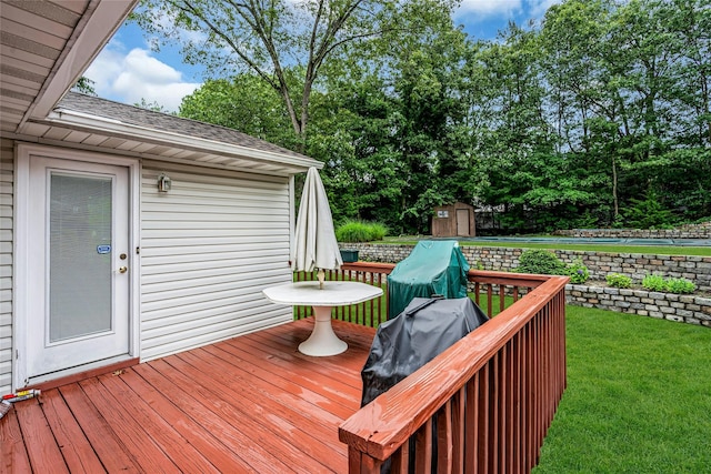 38 Mcarthur Ln, Smithtown, NY 11787 - wooden deck with a storage unit, a yard, and view of wooded area
