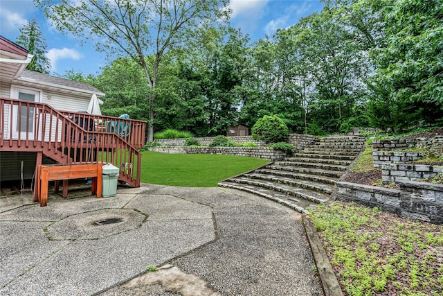 38 Mcarthur Ln, Smithtown, NY 11787 - view of green lawn with stairway, a wooden deck, and a patio
