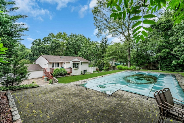 38 Mcarthur Ln, Smithtown, NY 11787 - view of pool featuring a wooden deck, a patio, and view of scattered trees