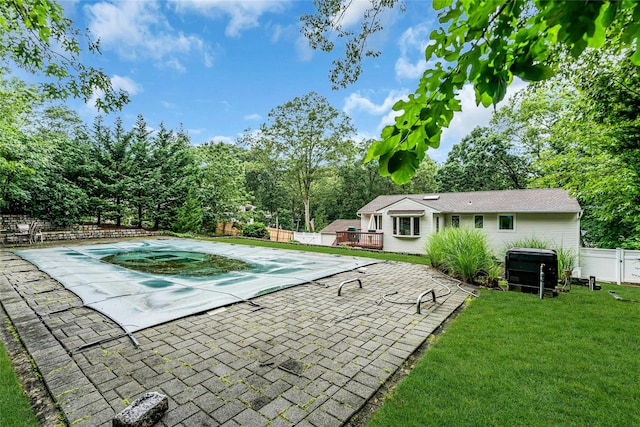 38 Mcarthur Ln, Smithtown, NY 11787 - view of pool featuring a fenced backyard, a wooden deck, a patio, and view of wooded area