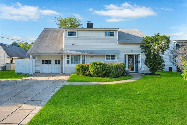 41 Meridian Rd, Levittown, NY 11756 - traditional-style home featuring an attached garage, a chimney, a front lawn, and driveway