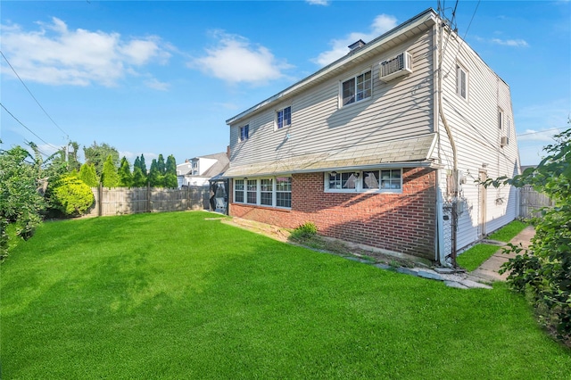 41 Meridian Rd, Levittown, NY 11756 - rear view of property featuring brick siding and a wall mounted AC