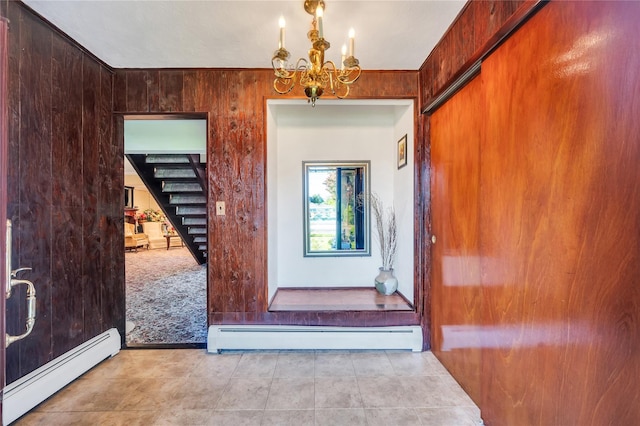 41 Meridian Rd, Levittown, NY 11756 - tiled entryway with a baseboard radiator, baseboard heating, a chandelier, and stairs