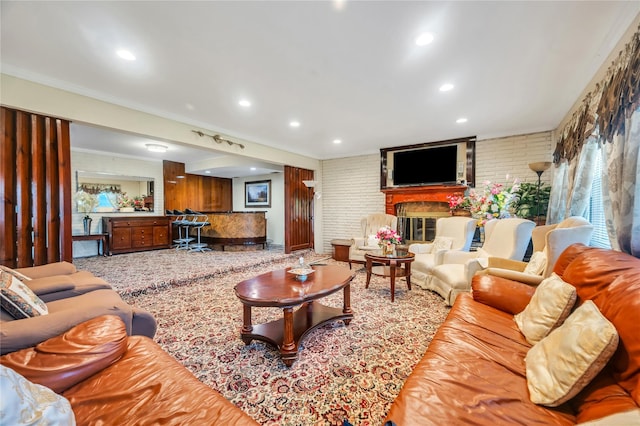41 Meridian Rd, Levittown, NY 11756 - living area with a fireplace, recessed lighting, ornamental molding, and brick wall