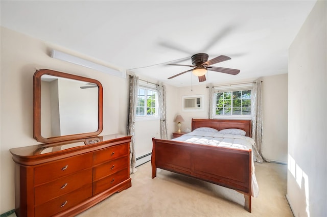 41 Meridian Rd, Levittown, NY 11756 - bedroom with baseboard heating, light colored carpet, and a ceiling fan