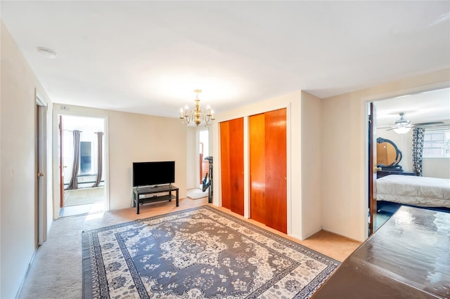 41 Meridian Rd, Levittown, NY 11756 - living room featuring a chandelier, light carpet, and a ceiling fan