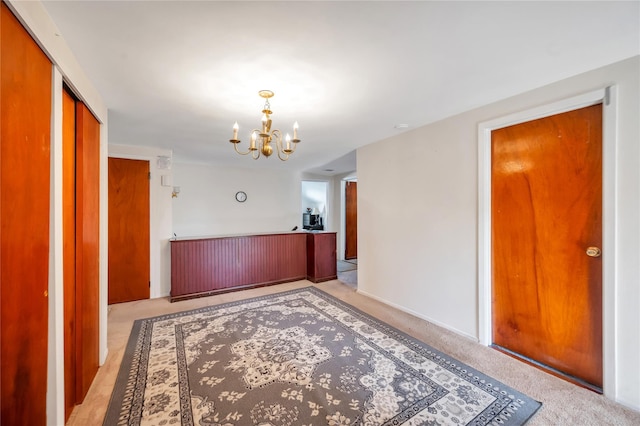41 Meridian Rd, Levittown, NY 11756 - hallway with a chandelier and light colored carpet