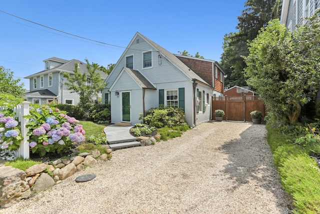 27 Soundview Ave, Locust Valley, NY 11560 - view of front of property featuring driveway, stucco siding, and a shingled roof