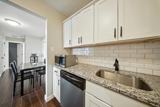 42 Inwood Rd, Middletown, NY 10941 - kitchen featuring stainless steel appliances, dark wood-type flooring, backsplash, light stone countertops, and white cabinetry