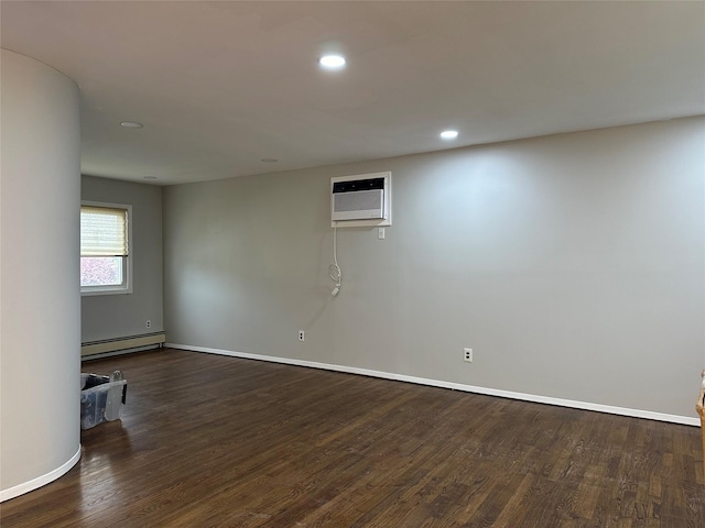 3666 Illona Ln, Oceanside, NY 11572 - unfurnished room featuring a baseboard heating unit, a wall unit AC, dark wood-style flooring, and recessed lighting