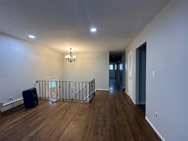 3666 Illona Ln, Oceanside, NY 11572 - corridor with an upstairs landing, a baseboard radiator, a chandelier, dark wood-style flooring, and recessed lighting