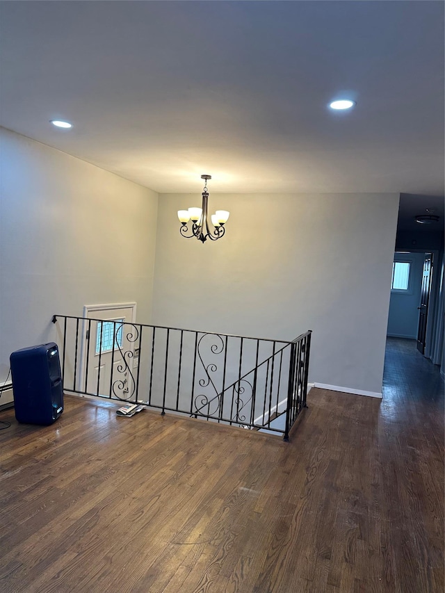 3666 Illona Ln, Oceanside, NY 11572 - stairs with a chandelier, wood finished floors, and recessed lighting
