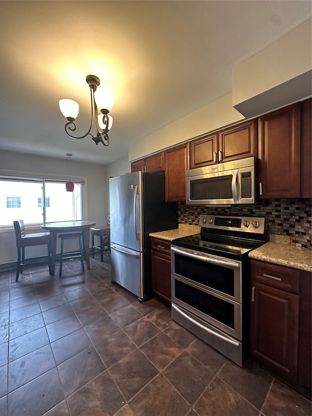 3666 Illona Ln, Oceanside, NY 11572 - kitchen featuring appliances with stainless steel finishes, backsplash, a chandelier, and hanging light fixtures