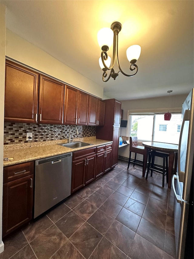 3666 Illona Ln, Oceanside, NY 11572 - kitchen with stainless steel appliances, decorative backsplash, a chandelier, pendant lighting, and dark tile patterned floors