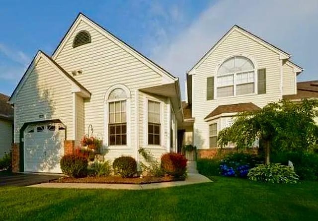 1405 Constance Ln, Port Jefferson Station, NY 11776 - view of front facade featuring driveway, a front lawn, and an attached garage
