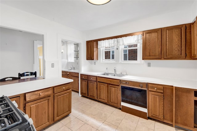 431 E Sidney Ave, Mount Vernon, NY 10553 - kitchen with brown cabinets, dishwasher, gas range oven, and light countertops