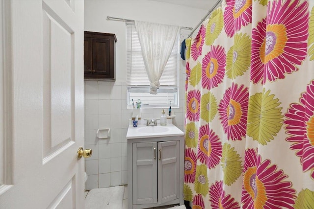 317 Hawthorne Ave, Yonkers, NY 10705 - bathroom featuring vanity, tile walls, and curtained shower