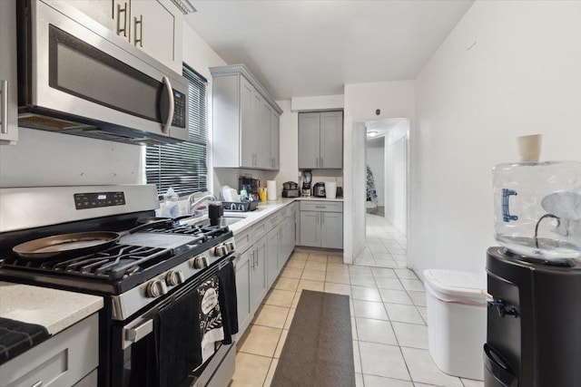 317 Hawthorne Ave, Yonkers, NY 10705 - kitchen featuring appliances with stainless steel finishes, gray cabinets, light countertops, and light tile patterned floors