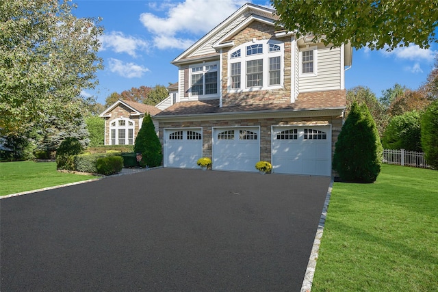 35 Monterrey Dr, Saint James, NY 11780 - view of front facade with stone siding, an attached garage, and driveway
