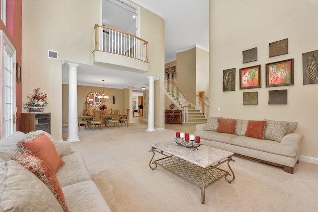 35 Monterrey Dr, Saint James, NY 11780 - carpeted living room with ornate columns, a towering ceiling, stairs, a chandelier, and beverage cooler
