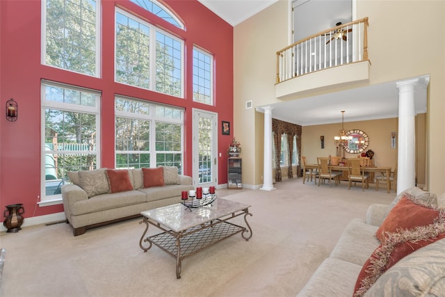 35 Monterrey Dr, Saint James, NY 11780 - living room featuring decorative columns, a high ceiling, carpet floors, healthy amount of natural light, and ornamental molding
