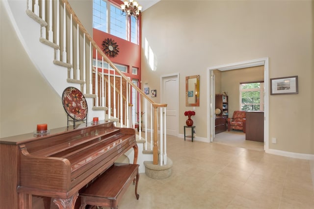 35 Monterrey Dr, Saint James, NY 11780 - entryway featuring a chandelier, stairway, and a towering ceiling