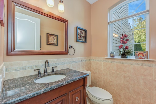 35 Monterrey Dr, Saint James, NY 11780 - half bath with vanity, wainscoting, and tile walls